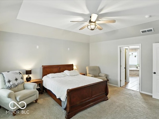 4233 Dartmoor Dr, Greenwood, IN 46143 - bedroom with carpet flooring, ceiling fan, and connected bathroom