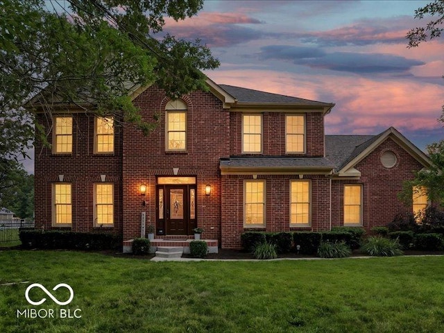 4233 Dartmoor Dr, Greenwood, IN 46143 - colonial house featuring a front yard and brick siding