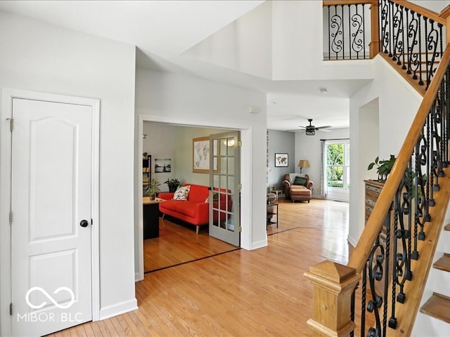 4233 Dartmoor Dr, Greenwood, IN 46143 - foyer featuring light wood-style flooring, stairway, and ceiling fan