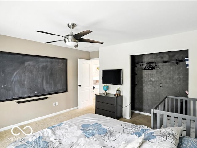 4233 Dartmoor Dr, Greenwood, IN 46143 - bedroom with carpet floors, a closet, and a ceiling fan