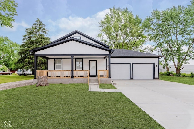 2125 N Pasadena St, Indianapolis, IN 46219 - view of front facade featuring driveway, an attached garage, a porch, and a front lawn