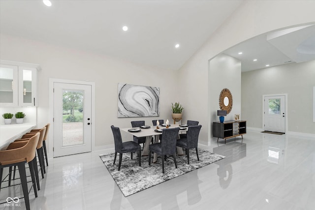 2125 N Pasadena St, Indianapolis, IN 46219 - dining space with arched walkways, plenty of natural light, recessed lighting, light tile patterned floors, and vaulted ceiling