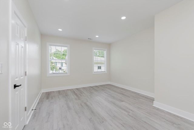 2125 N Pasadena St, Indianapolis, IN 46219 - spare room with light wood-style flooring and recessed lighting