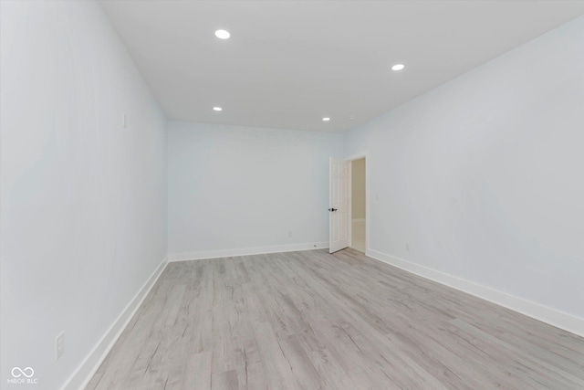 2125 N Pasadena St, Indianapolis, IN 46219 - empty room featuring light wood-style flooring and recessed lighting