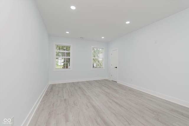 2125 N Pasadena St, Indianapolis, IN 46219 - empty room featuring light wood-style flooring and recessed lighting