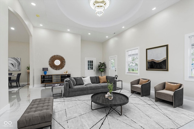 2125 N Pasadena St, Indianapolis, IN 46219 - living room with recessed lighting, a towering ceiling, arched walkways, and plenty of natural light