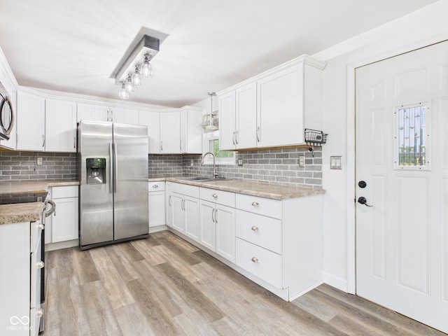 203 Plum St E, Frankton, IN 46044 - kitchen with stainless steel refrigerator with ice dispenser, electric range, backsplash, and light wood-type flooring