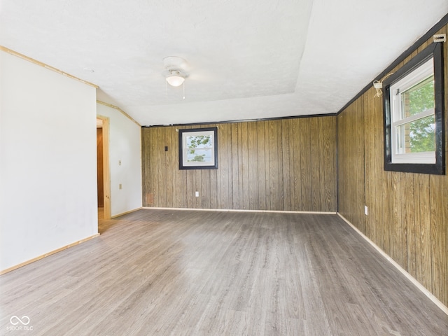 203 Plum St E, Frankton, IN 46044 - spare room featuring wood finished floors and wood walls