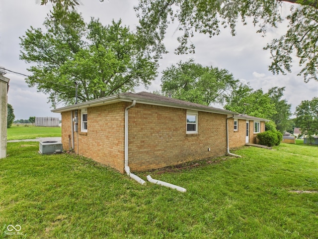 203 Plum St E, Frankton, IN 46044 - view of side of home featuring a yard and brick siding