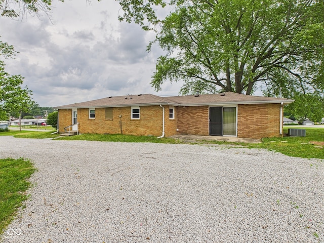 203 Plum St E, Frankton, IN 46044 - rear view of property with gravel driveway and brick siding