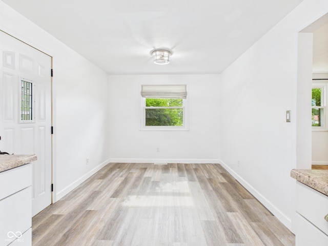 203 Plum St E, Frankton, IN 46044 - unfurnished dining area featuring healthy amount of natural light and light wood finished floors