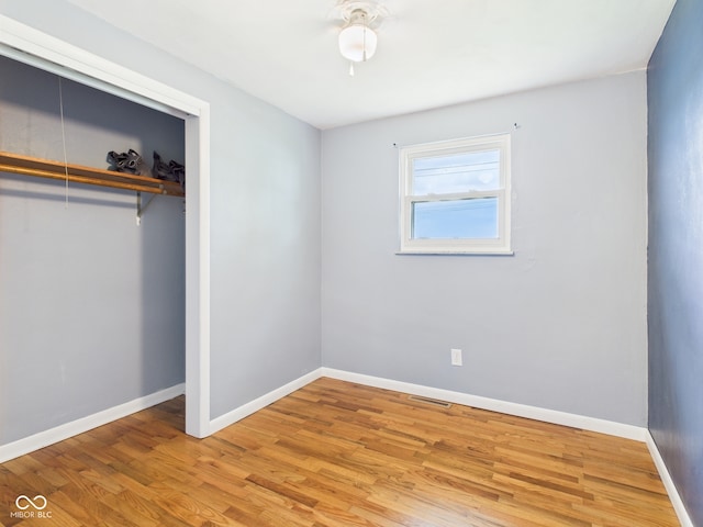 203 Plum St E, Frankton, IN 46044 - unfurnished bedroom with a closet and light wood-style flooring