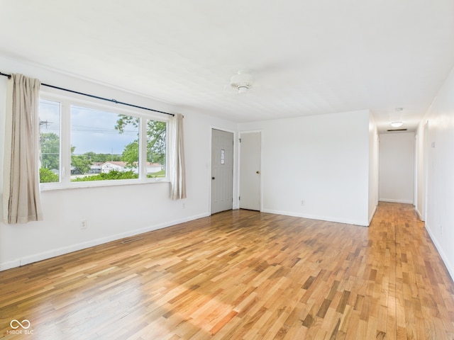 203 Plum St E, Frankton, IN 46044 - unfurnished room with light wood-style floors and baseboards