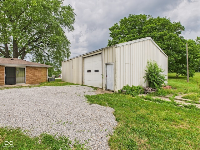 203 Plum St E, Frankton, IN 46044 - detached garage featuring gravel driveway