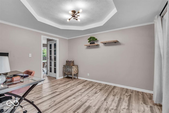 7502 Colony Cir, Indianapolis, IN 46260 - office area with a tray ceiling, light wood-style flooring, a textured ceiling, and ornamental molding