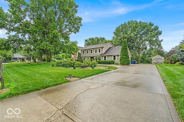 7502 Colony Cir, Indianapolis, IN 46260 - colonial house featuring a front lawn and a garage