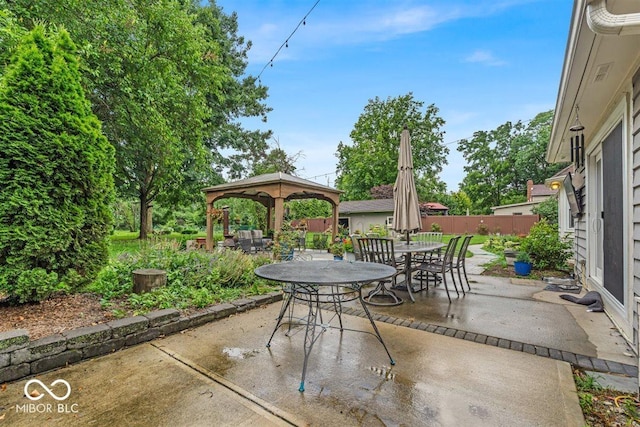 7502 Colony Cir, Indianapolis, IN 46260 - view of patio featuring a gazebo and outdoor dining area