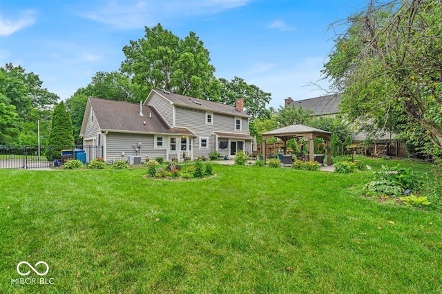 7502 Colony Cir, Indianapolis, IN 46260 - back of house with a gazebo, a patio, and a chimney