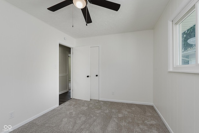 5134 Rinehart Ave, Indianapolis, IN 46241 - unfurnished bedroom with carpet, a closet, and a ceiling fan