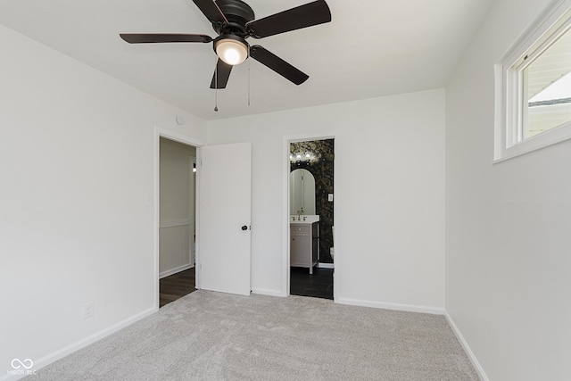 5134 Rinehart Ave, Indianapolis, IN 46241 - unfurnished bedroom with carpet flooring, connected bathroom, and a ceiling fan