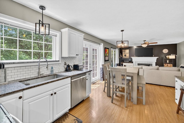 13470 Shakamac Dr, Carmel, IN 46032 - kitchen featuring dishwasher, ceiling fan, light wood-style floors, backsplash, and white cabinets