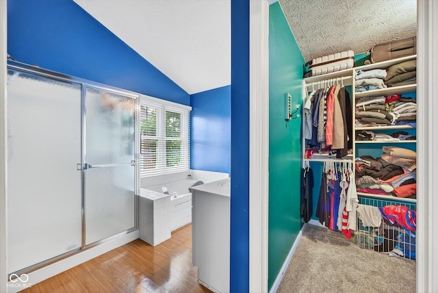 13470 Shakamac Dr, Carmel, IN 46032 - walk in closet with lofted ceiling and wood finished floors