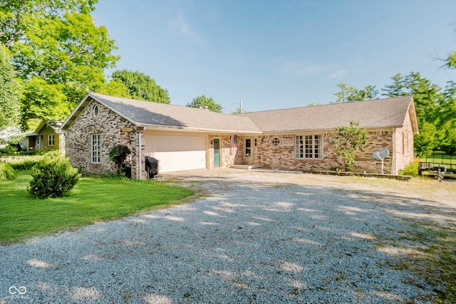 450 W 250 N, Lebanon, IN 46052 - ranch-style house featuring an attached garage, driveway, brick siding, and a front lawn