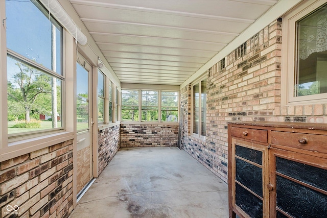 450 W 250 N, Lebanon, IN 46052 - unfurnished sunroom featuring brick wall and unfinished concrete floors