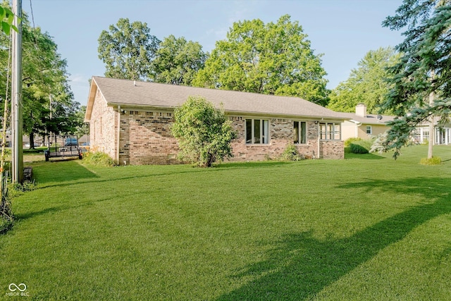 450 W 250 N, Lebanon, IN 46052 - ranch-style home with brick siding, a front lawn, and a chimney