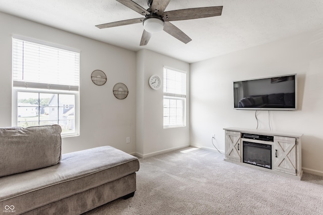 6902 Diamondleaf Way, Brownsburg, IN 46112 - carpeted living area with a ceiling fan and a glass covered fireplace
