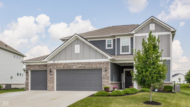 6902 Diamondleaf Way, Brownsburg, IN 46112 - craftsman house with brick siding, a front yard, driveway, a garage, and roof with shingles