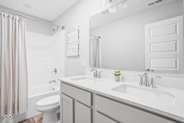 3969 Canning St, Danville, IN 46122 - full bathroom featuring shower / tub combo, double vanity, and wood finished floors
