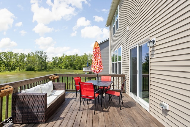 3969 Canning St, Danville, IN 46122 - wooden terrace featuring outdoor dining area, an outdoor living space, a water view, and a lawn
