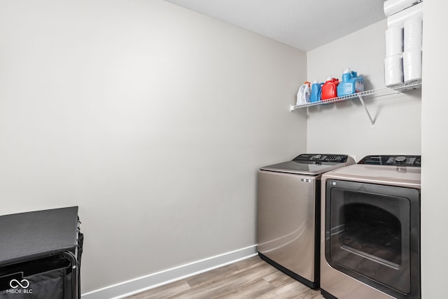 3969 Canning St, Danville, IN 46122 - laundry room with independent washer and dryer and light wood-type flooring