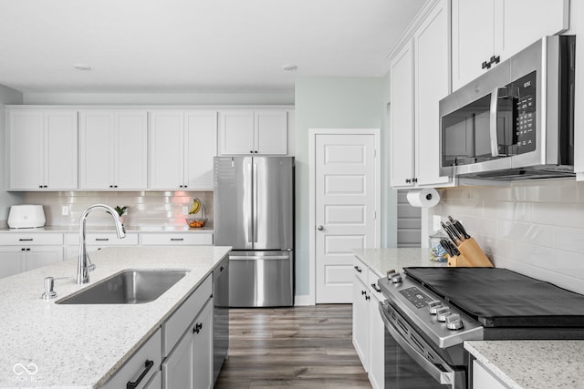 3969 Canning St, Danville, IN 46122 - kitchen featuring stainless steel appliances, dark wood finished floors, backsplash, and white cabinets