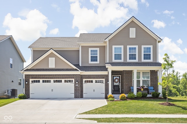3969 Canning St, Danville, IN 46122 - view of front facade with concrete driveway, a front yard, brick siding, and a porch
