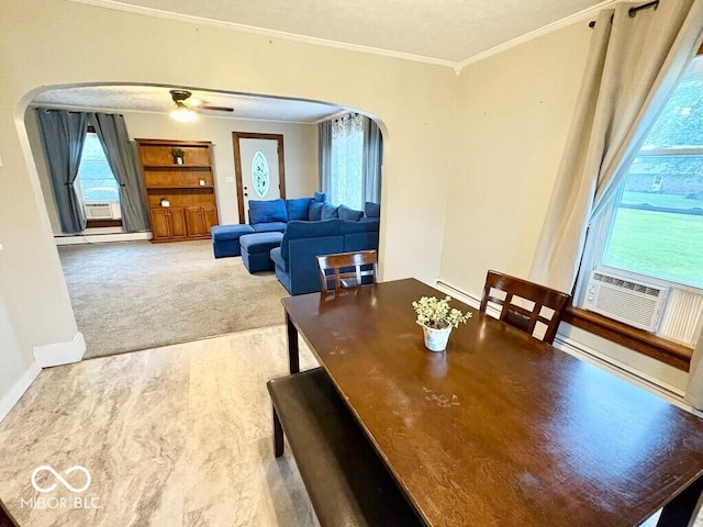 1076 N Old Highway 27, Winchester, IN 47394 - dining area featuring arched walkways, crown molding, a baseboard radiator, wood finished floors, and healthy amount of natural light