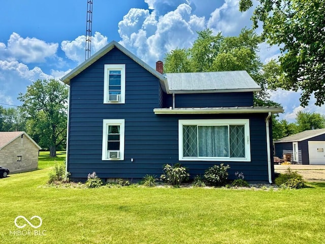 1076 N Old Highway 27, Winchester, IN 47394 - back of property with a lawn and a chimney