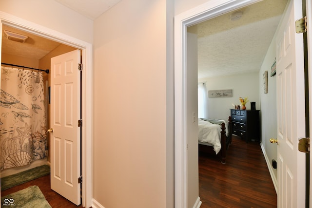 9022 Hosta Way, Camby, IN 46113 - corridor with a textured ceiling and dark wood-style flooring