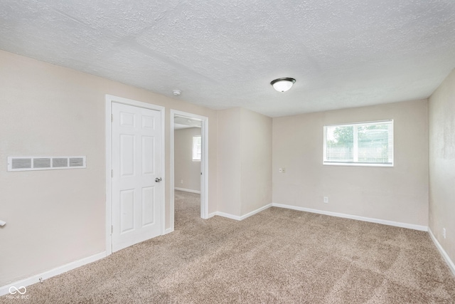 3515 Bearwood Ct, Indianapolis, IN 46235 - carpeted empty room with a textured ceiling