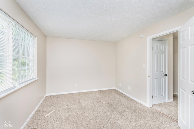 3515 Bearwood Ct, Indianapolis, IN 46235 - spare room featuring light colored carpet and a textured ceiling