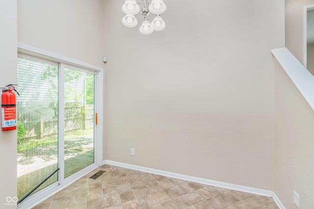 3515 Bearwood Ct, Indianapolis, IN 46235 - spare room featuring a chandelier and baseboards