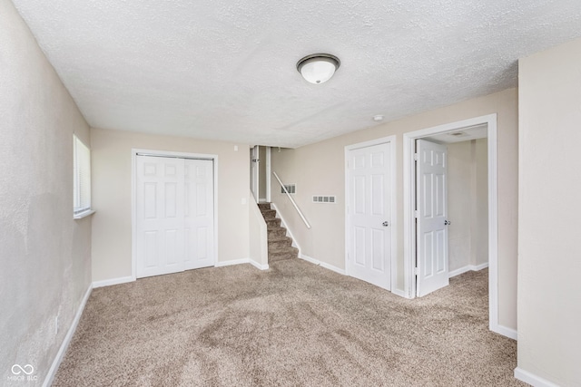 3515 Bearwood Ct, Indianapolis, IN 46235 - finished basement featuring carpet, stairs, and a textured ceiling