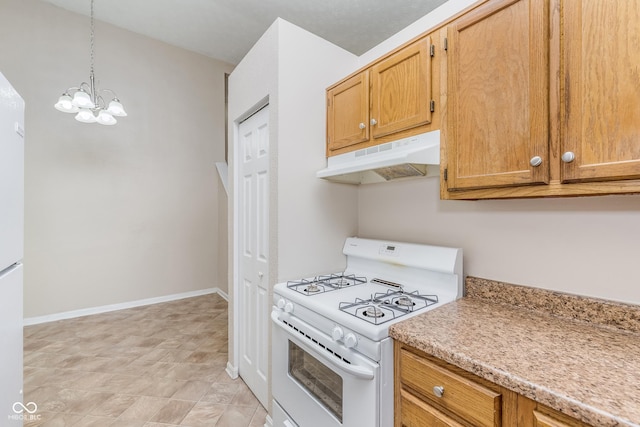 3515 Bearwood Ct, Indianapolis, IN 46235 - kitchen with gas range gas stove, under cabinet range hood, light countertops, pendant lighting, and a chandelier