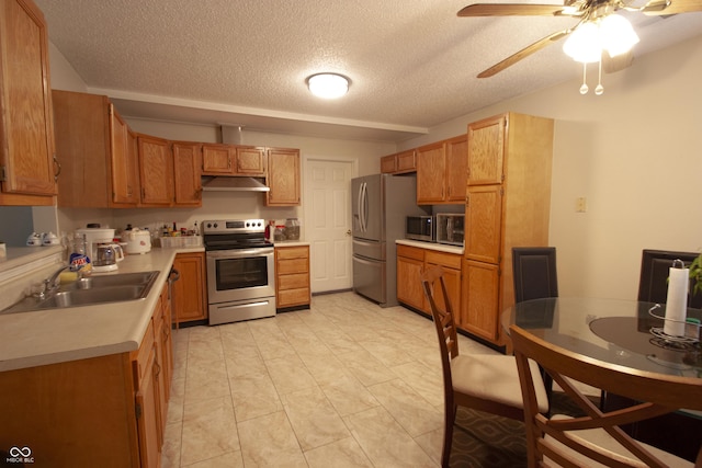 291 Lakemoore St, Brownsburg, IN 46112 - kitchen featuring appliances with stainless steel finishes, under cabinet range hood, a textured ceiling, light countertops, and ceiling fan