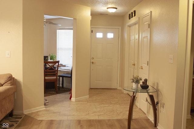 291 Lakemoore St, Brownsburg, IN 46112 - foyer entrance with a textured ceiling and a ceiling fan