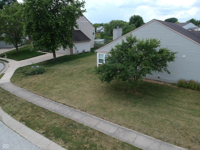 291 Lakemoore St, Brownsburg, IN 46112 - view of property exterior featuring a yard and a chimney