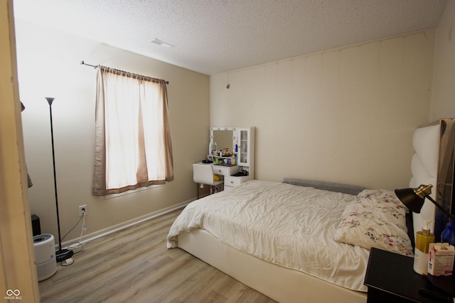 291 Lakemoore St, Brownsburg, IN 46112 - bedroom with wood finished floors and a textured ceiling