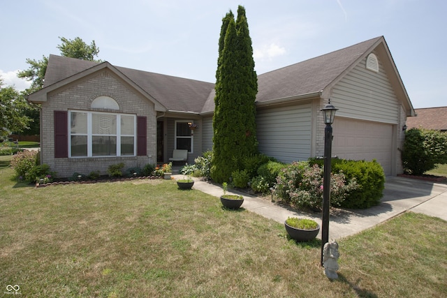 291 Lakemoore St, Brownsburg, IN 46112 - ranch-style home with brick siding, an attached garage, concrete driveway, and a front yard
