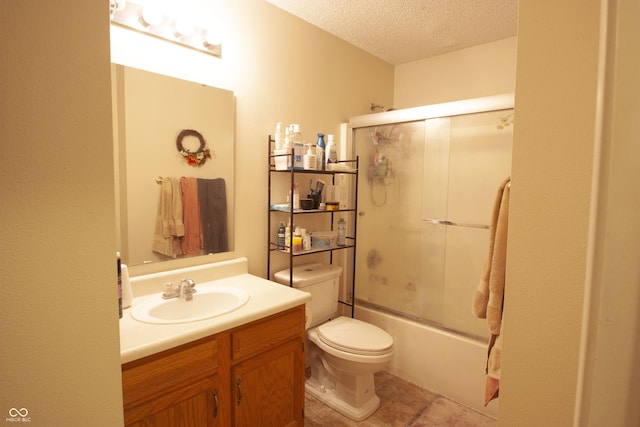 291 Lakemoore St, Brownsburg, IN 46112 - bathroom featuring a textured ceiling, vanity, shower / bath combination with glass door, and tile patterned flooring